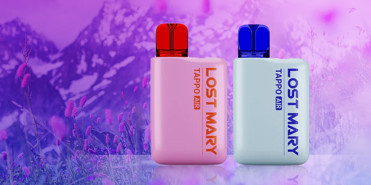 Two Lost Mary Tappo Air Vapes 20 mg in pink with red mouthpiece and light blue with blue mouthpiece in front of mountain meadow