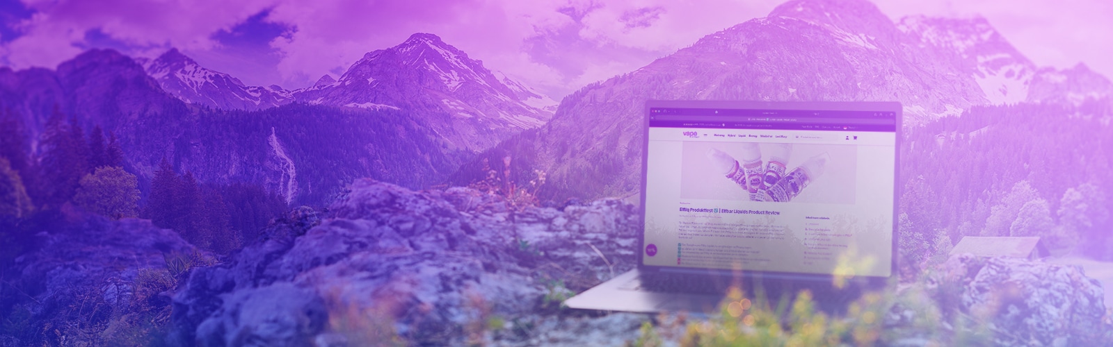 Laptop with an open vape website in front of an alpine mountain landscape, purple color scheme in the background