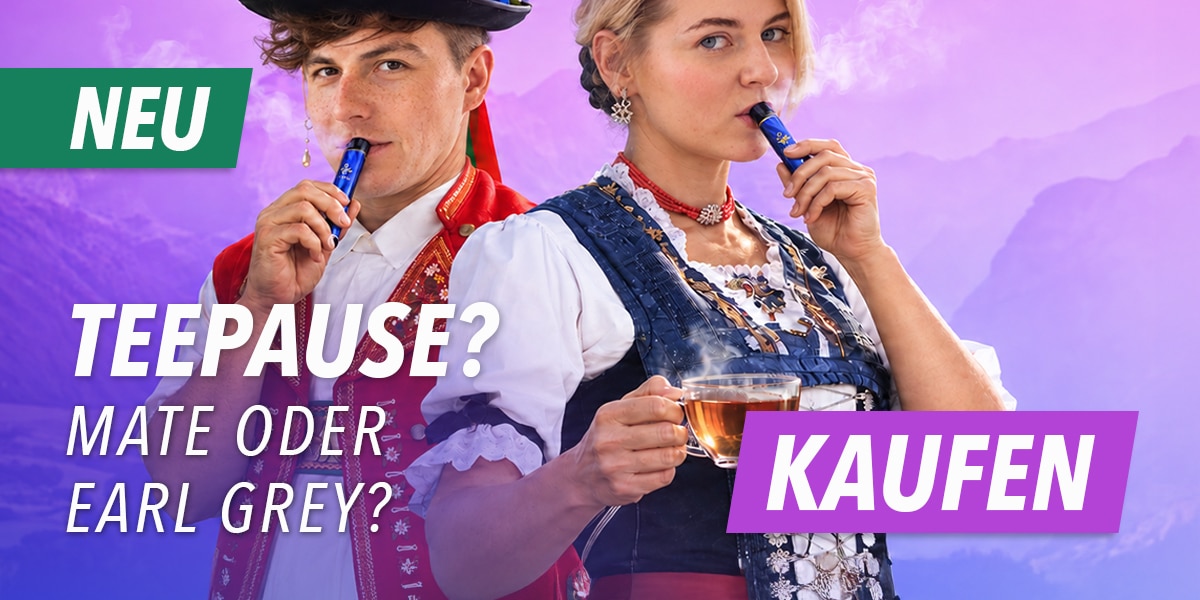 Werbebild: zwei Personen in Tracht mit blauem Einweg Vape; Text „Teepause? Mate oder Earl Grey?“ 20 mg